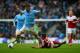 MANCHESTER, ENGLAND - MARCH 22: Aleksandar Kolarov of Manchester City clashes with Patrick Roberts of Fulham during the Barclays Premier League match between Manchester City and Fulham at Etihad Stadium on March 22, 2014 in Manchester, England. (Photo