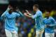 MANCHESTER, ENGLAND - MARCH 22: Yaya Toure of Manchester City celebrates scoring his hat trick with Aleksandar Kolarov of Manchester City during the Barclays Premier League match between Manchester City and Fulham at Etihad Stadium on March 22, 2014 in M