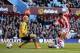 BIRMINGHAM, ENGLAND - MARCH 23: Peter Odemwingie of Stoke shoots past goalkeeper Brad Guzan of Aston Villa to score a goal to level the scores at 1-1 during the Barclays Premier League match between Aston Villa and Stoke City at Villa Park on March 23, 2