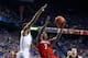 LEXINGTON, KY - DECEMBER 28: Russ Smith #2 of the Louisville Cardinals shoots the ball while defended by Aaron Harrison #2 of the Kentucky Wildcats during the game at Rupp Arena on December 28, 2013 in Lexington, Kentucky. (Photo by Andy Lyons/Getty Ima