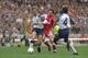 1992: Ray Houghton (centre) of Liverpool chases Anton Rogan (left) of Sunderland as team mate Gary Bennett (right) moves in during the FA Cup final at Wembley Stadium in London. Liverpool won the match 2-0. \ Mandatory Credit: Shaun Botterill/Allsport