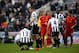 NEWCASTLE UPON TYNE, ENGLAND - APRIL 27: Steven Taylor of Newcastle United consoles Mapou Yanga-Mbiwa after their 6-0 defeat during the Barclays Premier League match between Newcastle United and Liverpool at St James' Park on April 27, 2013 in Newcastle