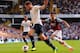 LONDON, ENGLAND - OCTOBER 06: Jan Vertonghen (L) of Tottenham clears under pressure from Ravel Morrison of West Ham during the Barclays Premier League match between Tottenham Hotspur and West Ham United at White Hart Lane on October 6, 2013 in London, Eng