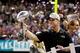 NEW ORLEANS, LA - FEBRUARY 03: Head coach John Harbaugh of the Baltimore Ravens celebrates with the VInce Lombardi Championship trophy after the Ravens won 34-31 against the San Francisco 49ers during Super Bowl XLVII at the Mercedes-Benz Superdome on Fe