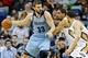 Mar 12, 2014; New Orleans, LA, USA; Memphis Grizzlies center Marc Gasol (33) is guarded by New Orleans Pelicans center Alexis Ajinca (42) during the second quarter of a game at the Smoothie King Center. Mandatory Credit: Derick E. Hingle-USA TODAY Sports