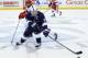 ST PAUL, MN - MARCH 21: Tommy Olczyk #14 of the Penn State Nittany Lions controls the puck against Kevin Schulze #28 of the Wisconsin Badgers during the first period of the semifinal game of the Big Ten Men's Ice Hockey Championship on March 21, 2014 at X