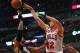 CHICAGO, IL - MARCH 24: Kirk Hinrich #12 of the Chicago Bulls leaps to pass over David West #21 of the Indiana Pacers at the United Center on March 24, 2014 in Chicago, Illinois. NOTE TO USER: User expressly acknowledges and agrees that, by downloading an