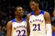 LAWRENCE, KS - NOVEMBER 22: Andrew Wiggins #22 of the Kansas Jayhawks talks with Joel Embiid #21 as they walk onto the floor after a timeout during the game against the Towson Tigers at Allen Fieldhouse on November 22, 2013 in Lawrence, Kansas. (Photo by