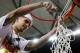 ATLANTA, GA - MARCH 16: Scottie Wilbekin #5 of the Florida Gators celebrates by cutting down the net after their 61 to 60 win over the Kentucky Wildcats in the Championship game of the 2014 Men's SEC Basketball Tournament at Georgia Dome on March 16, 201