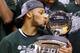 INDIANAPOLIS, IN - MARCH 16: Adreian Payne #5 of the Michigan State Spartans kisses the trophy after the 69-55 win over the Michigan Wolverines during the finals of the Big Ten Basketball Tournament at Bankers Life Fieldhouse on March 16, 2014 in Indian
