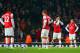 LONDON, ENGLAND - MARCH 25: A dejected Mikel Arteta of Arsenal holds his head in his hands after Mathieu Flamini of Arsenal (not pictured) scored an own goal in the final minutes during the Barclays Premier League match between Arsenal and Swansea City a