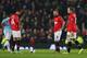MANCHESTER, ENGLAND - MARCH 25: Javier Hernandez of Manchester United and team-mates Juan Mata and Wayne Rooney (R) look dejected after conceding the third goal during the Barclays Premier League match between Manchester United and Manchester City at Old