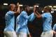MANCHESTER, ENGLAND - MARCH 25: Yaya Toure of Manchester City celebrates scoring the third goal with his team-mates Fernandinho and Vincent Kompany (L) during the Barclays Premier League match between Manchester United and Manchester City at Old Trafford