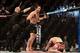 Mar 16, 2013; Montreal, Quebec, CAN; Jake Ellenberger (red) celebrates after defeating Nate Marquardt (blue) in their main card bout at UFC 158 at the Bell Centre. Mandatory Credit: Eric Bolte-USA TODAY Sports