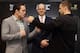 SINGAPORE - NOVEMBER 06: Jake 'The Juggernaugh' Ellenberger (L) and Tarec 'Sponge' Saffiedine (R) face off as Mark Fischer, Managing Director of UFC Asia looks on during the Ultimate Fighting Championship (UFC) press conference at Marina Bay Sands on Nov