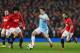 MANCHESTER, ENGLAND - MARCH 25: Samir Nasri of Manchester City competes with Marouane Fellaini and Juan Mata (R) of Manchester United during the Barclays Premier League match between Manchester United and Manchester City at Old Trafford on March 25, 2014