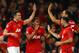 MANCHESTER, ENGLAND - MARCH 19: Robin van Persie of Manchester United celebrates scoring the second goal with his team-mates during the UEFA Champions League Round of 16 second round match between Manchester United and Olympiacos FC at Old Trafford on Ma
