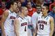 SAN DIEGO, CA - MARCH 23: Aaron Gordon #11, T.J. McConnell #4 and Nick Johnson #13 of the Arizona Wildcats react in their 84 to 61 win over the Gonzaga Bulldogs during the third round of the 2014 NCAA Men's Basketball Tournament at Viejas Arena on March