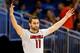 ORLANDO, FL - MARCH 20: Luke Hancock #11 of the Louisville Cardinals celebrates after his second three point in the second half against the Manhattan Jaspers during the second round of the 2014 NCAA Men's Basketball Tournament at Amway Center on March 20