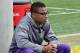 Malachi Dupre sits and observes spring practice.