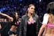 Tamina Snuka protects AJ Lee from Brie Bella.