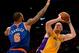 LOS ANGELES, CA - MARCH 25: Chris Kaman #9 of the Los Angeles Lakers shoots over Tyson Chandler #6 of the New York Knicks at Staples Center on March 25, 2014 in Los Angeles, California. NOTE TO USER: User expressly acknowledges and agrees that, by down