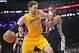 March 19, 2014; Los Angeles, CA, USA; Los Angeles Lakers center Pau Gasol (16) moves to the basket against the San Antonio Spurs during the first half at Staples Center. Mandatory Credit: Gary A. Vasquez-USA TODAY Sports