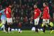 MANCHESTER, ENGLAND - MARCH 25: Javier Hernandez of Manchester United and team-mates Juan Mata and Wayne Rooney (R) look dejected after conceding the third goal during the Barclays Premier League match between Manchester United and Manchester City at Old