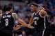 Mar 23, 2014; Dallas, TX, USA; Brooklyn Nets guard Deron Williams (8) and forward Paul Pierce (34) celebrate during overtime against the Dallas Mavericks at the American Airlines Center. The Nets defeated the Mavericks 107-104 in overtime. Mandatory Credi