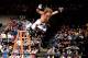 Shawn Michaels leaps at Razor Ramon during WrestleMania X.