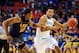 Mar 14, 2014; Atlanta, GA, USA; Kentucky Wildcats guard Andrew Harrison (5) brings the ball up court against LSU Tigers forward Jarell Martin (12) during the second half in the quarterfinals of the SEC college basketball tournament at Georgia Dome. Kentuc