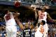 GREENSBORO, NC - MARCH 13: Kammeon Holsey #24 of the Georgia Tech Yellow Jackets is hit by teammates Damarcus Harrison #21, K.J. McDaniels #32 and Landry Nnoko #35 of the Clemson Tigers during the second round of the 2014 Men's ACC Basketball Tournament