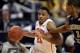 Mar 13, 2014; Greensboro, NC, USA; Clemson Tigers guard Damarcus Harrison (21) pushes the ball up the court against Georgia Tech Yellow Jackets forward Marcus Georges-Hunt (3) in the second round of the ACC college basketball tournament at Greensboro Col