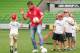 MELBOURNE, AUSTRALIA - MARCH 05: Harry Kewell of the Melbourne Heart football team plays a game with children during the launch of 'Premier's Active April' at AAMI Park on March 5, 2014 in Melbourne, Australia. The program aims at promoting a healthy and