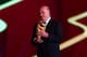 COSTA DO SAUIPE, BRAZIL - DECEMBER 06: Spain coach Vicente del Bosque holds the World Cup trophy on stage before the Final Draw for the 2014 FIFA World Cup Brazil at Costa do Sauipe Resort on December 6, 2013 in Costa do Sauipe, Bahia, Brazil. (Photo b