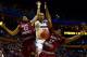 BUFFALO, NY - MARCH 20: Shabazz Napier #13 of the Connecticut Huskies goes to the basket as DeAndre Bembry #43 and Ronald Roberts, Jr. #13 of the Saint Joseph's Hawks defend during the second round of the 2014 NCAA Men's Basketball Tournament at the First