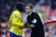 STOKE ON TRENT, ENGLAND - MARCH 01: Referee Mike Jones talks with Bacary Sagna during the Barclays Premier League match between Stoke City and Arsenal at Britannia Stadium on March 1, 2014 in Stoke on Trent, England. (Photo by Laurence Griffiths/Getty I