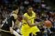 MILWAUKEE, WI - MARCH 20: Glenn Robinson III #1 of the Michigan Wolverines drives against Lee Skinner #34 of the Wofford Terriers in the second half during the second round of the 2014 NCAA Men's Basketball Tournament at BMO Harris Bradley Center on Marc