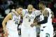 SPOKANE, WA - MARCH 22: Denzel Valentine #45 Adreian Payne #5, Keith Appling #11 and Branden Dawson #22 of the Michigan State Spartans celebrate in the second half of their 80 to 73 win over the Harvard Crimson during the Third Round of the 2014 NCAA Bas