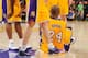LOS ANGELES, CA - APRIL 12: Kobe Bryant #24 of the Los Angeles Lakers speaks with teammates Pau Gasol #16 and Steve Blake #5 after getting injured during a game against the Golden State Warriors at Staples Center on April 12, 2013 in Los Angeles, Californ