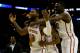 SAN ANTONIO, TX - MARCH 23: DeAndre Kane #50, Monte Morris #11 and Daniel Edozie #42 of the Iowa State Cyclones celebrate after defeating the North Carolina Tar Heels 85-83 in the third round of the 2014 NCAA Men's Basketball Tournament at the AT&T Cente