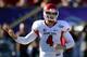 LAS VEGAS, NV - DECEMBER 21: Quarterback Derek Carr #4 of the Fresno State Bulldogs signals teammates during the team's game against the USC Trojans in the Royal Purple Las Vegas Bowl at Sam Boyd Stadium on December 21, 2013 in Las Vegas, Nevada. USC won