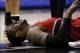 Mar 12, 2014; San Antonio, TX, USA; Portland Trail Blazers forward LaMarcus Aldridge (12) lays on the floor after being fouled by San Antonio Spurs forward Aron Baynes (16) during the second half at AT&T Center. Mandatory Credit: Soobum Im-USA TODAY Sport