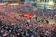 LIVERPOOL, ENGLAND - MAY 26: The Liverpool team ride on an open top bus through a mass of fans as they arrive at St. George's Hall during the Liverpool Champions League Victory Parade on May 26, 2005 in Liverpool, England. Over 500,000 cheering fans line