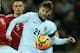 LONDON, ENGLAND - MARCH 05: Adam Lallana of England challenges for the ball with Niki Zimling of Denmark during the International Friendly match between England and Denmark at Wembley Stadium on March 5, 2014 in London, England. (Photo by Richard Heathc