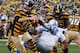 PITTSBURGH, PA - NOVEMBER 17: Ben Roethlisberger #7 of the Pittsburgh Steelers avoids a second quarter sack by Nick Fairley #98 of the Detroit Lions at Heinz Field on November 17, 2013 in Pittsburgh, Pennsylvania. Pittsburgh won the game 37-27. (Photo by
