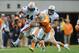 Nov 9, 2013; Knoxville, TN, USA; Auburn Tigers running back Cameron Artis-Payne (44) runs the ball against Tennessee Volunteers defensive back Max Arnold (46) during the second half at Neyland Stadium. Auburn won 55 to 23. Mandatory Credit: Randy Sartin-U