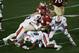 Jan 6, 2014; Pasadena, CA, USA; Florida State Seminoles quarterback Jameis Winston (5) is tackled by Auburn Tigers linebacker Kris Frost (17), linebacker Cassanova McKinzy (8), and defensive tackle Montravius Adams (1) during the first half of the 2014 BC