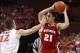 Dec 4, 2013; Charlottesville, VA, USA; Wisconsin Badgers guard Josh Gasser (21) holds the ball as Virginia Cavaliers guard Joe Harris (12) defends in the first half at John Paul Jones Arena. The Badgers won 48-38. Mandatory Credit: Geoff Burke-USA TODAY S