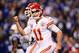 Jan 4, 2014; Indianapolis, IN, USA; Kansas City Chiefs quarterback Alex Smith (11) celebrates after throwing a pass for a touchdown during the second quarter of the 2013 AFC wild card playoff football game against the Indianapolis Colts at Lucas Oil Stadi